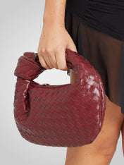 Άουρα | Μίνι Τσάντα με Πλεκτό Κόμπο Χερούλι από Οικολογικό Δέρμα σε Απόχρωση Κρασιού